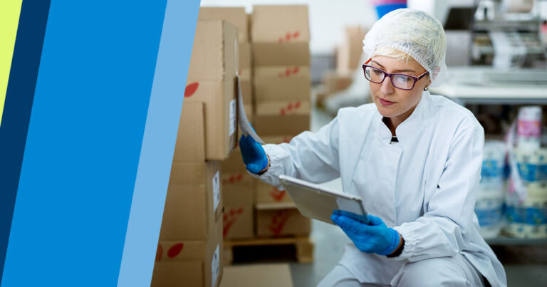 A person in a lab coat, hairnet, and gloves examines boxes and checks a tablet in a warehouse or laboratory setting—demonstrating the meticulous attention to detail required to become a freight agent.