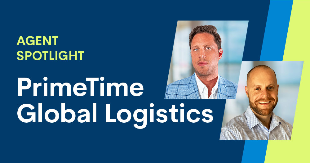 Two men in business attire are featured with text: Agent Spotlight: PrimeTime Global Logistics, highlighting their expertise in global logistics, on a blue and yellow background.